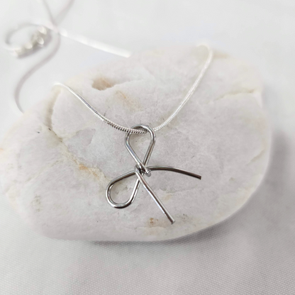 necklace, trendy jewelry, handcrafted jewelry, stud earrings, handmade, stainless steel chain, bow pendant, snake chain, artisan jewelry, luxury jewelry
